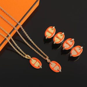 Alternative view of Hermes Mini Maillon Earrings Lacquered Metal Yellow Gold Orange Soie H100052FE02